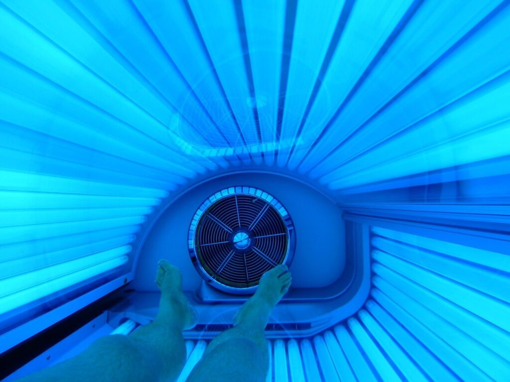 Can You Wear Headphones in a Tanning Bed